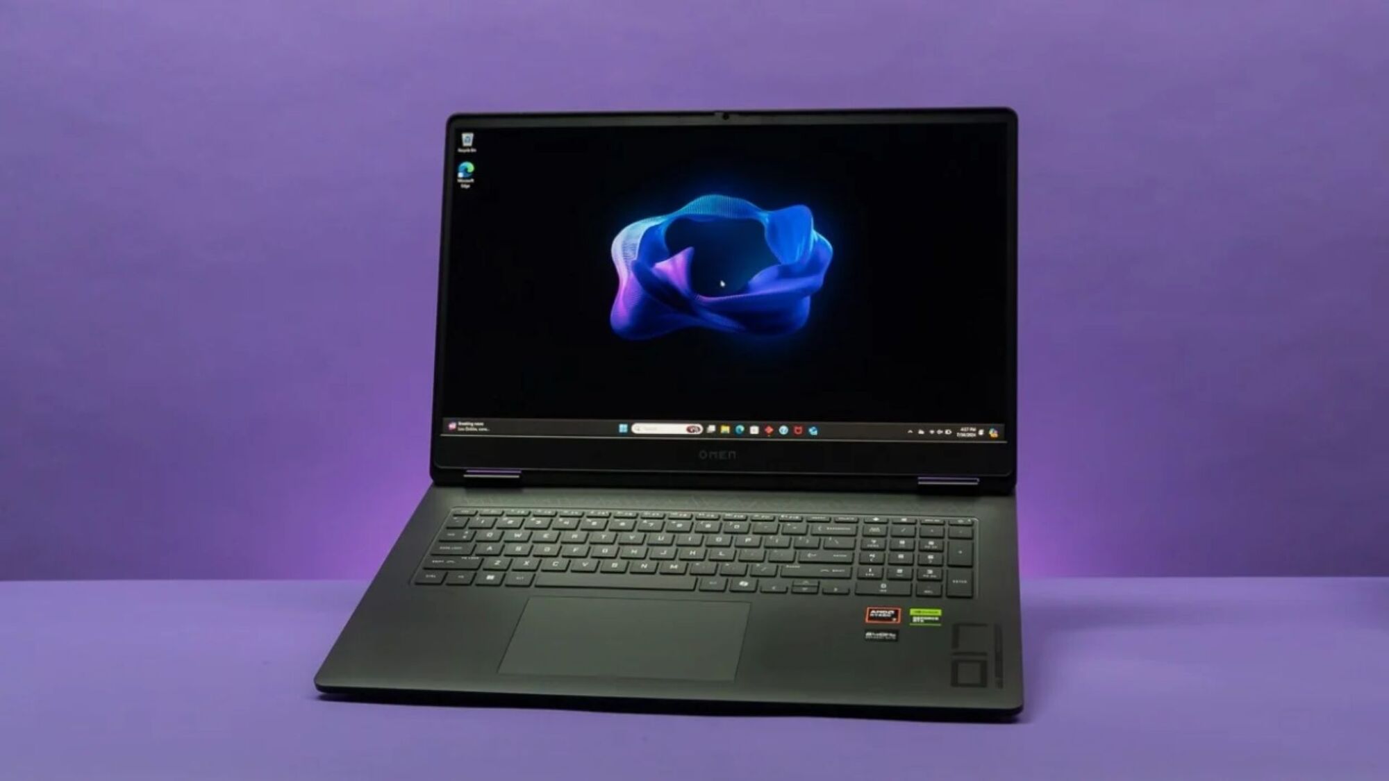 hp omen 17 laptop angled against a solid purple background