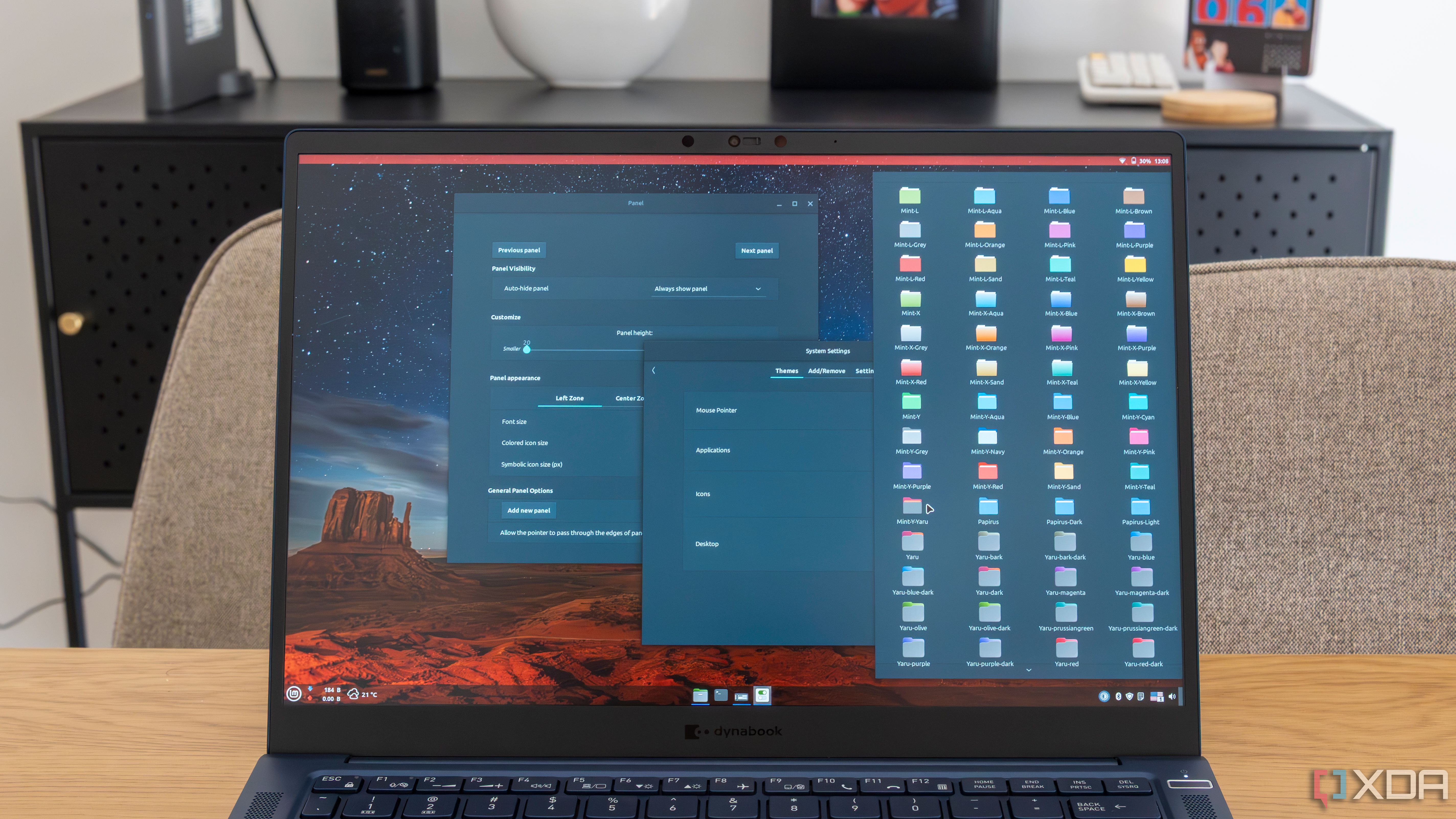 A laptop running Linux Mint and showing various customization options