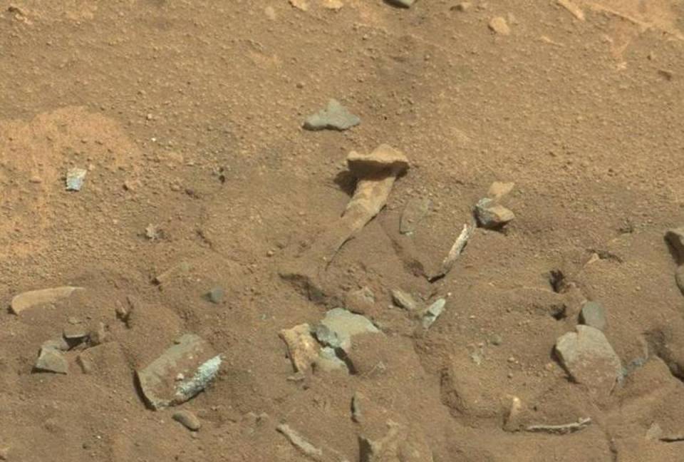 Mars surface with rocks and debris.