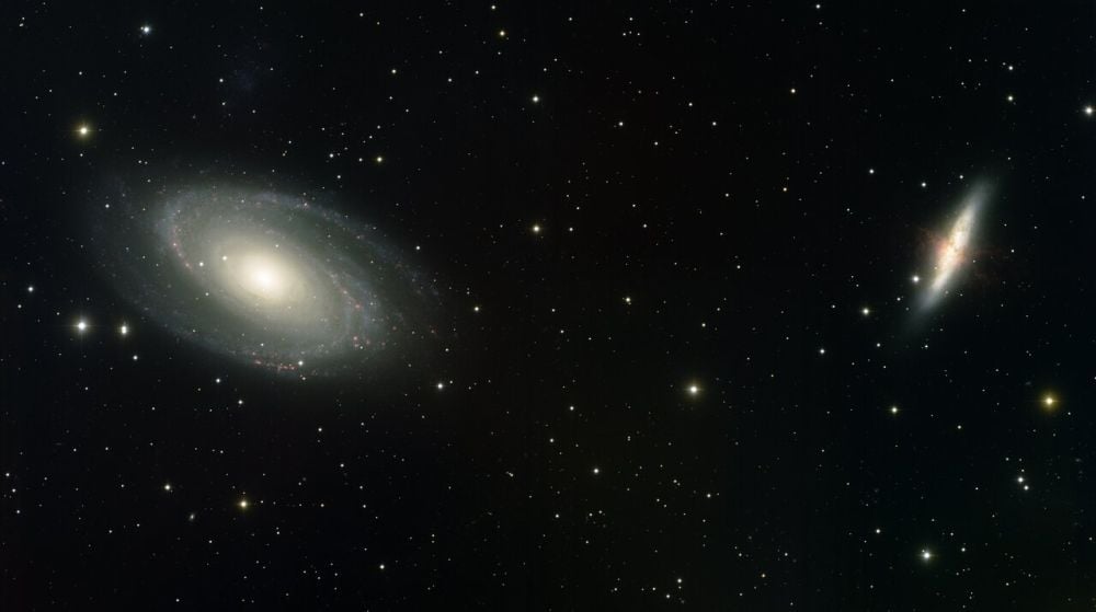 M81 (left) and M82 (right) interact gravitationally and orbit one another once every 100 million years or so. The interactions have stretched the smaller M82 into a cigar shape, leading to its nickname, the Cigar Galaxy. The interactions are also triggering starburst episodes, evidenced by the filaments of red hydrogen gas. Image Credit: T.A. Rector (University of Alaska Anchorage) and NOIRLab/NSF/AURA/