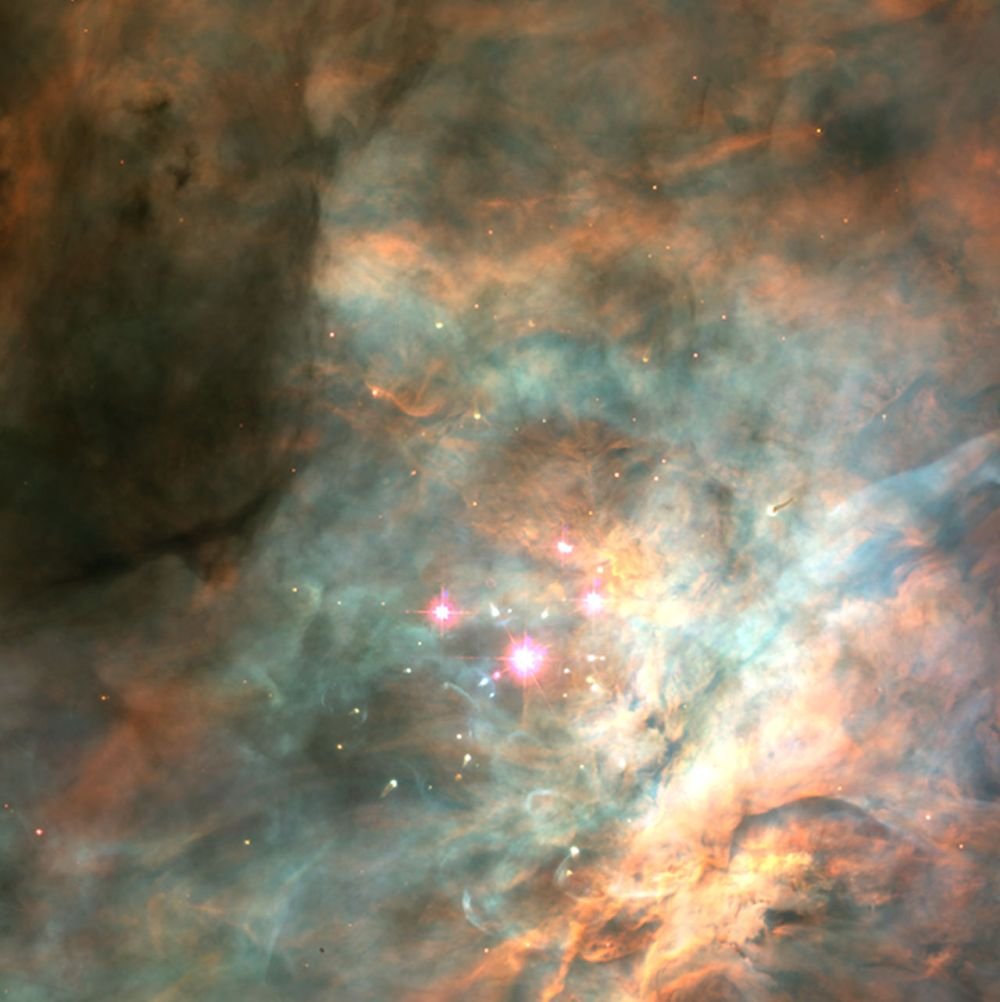 This Hubble Space Telescope image shows the Trapezium Cluster, the most well-known part of the Orion Nebula Cluster. Since the ONC is young, there's still plenty of gas and dust that obscures its view. Image Credit: C.R. O'Dell and S.K. Wong (Rice University) and NASA/ESA