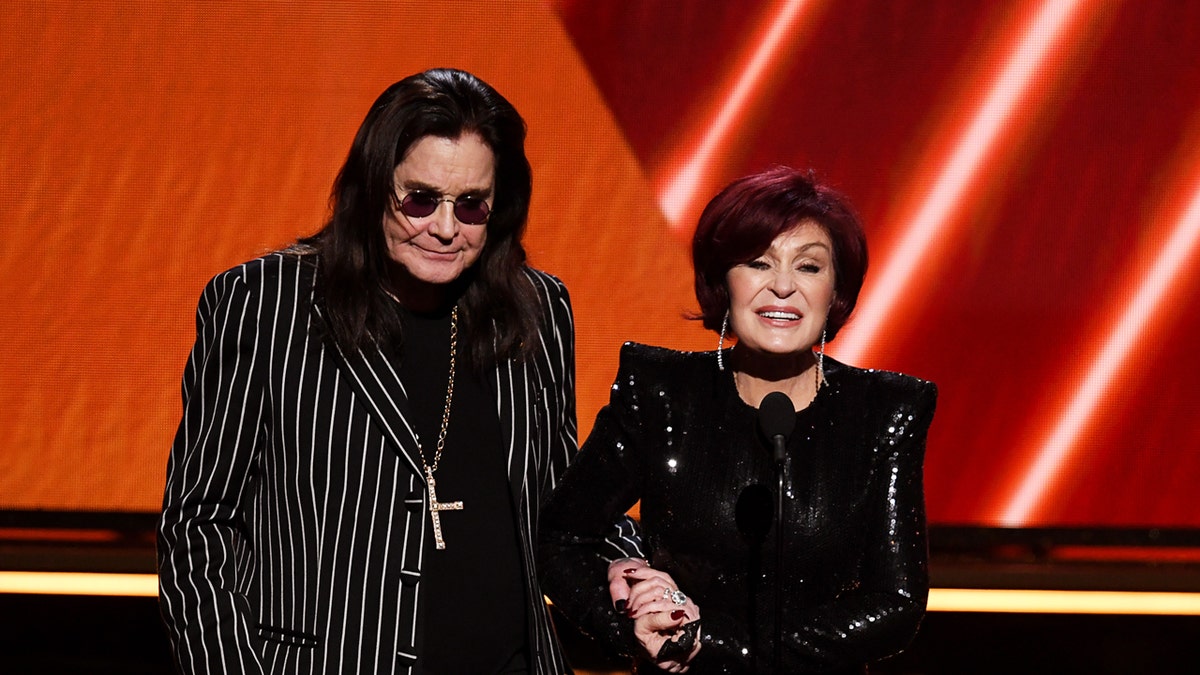 Ozzy Osbourne and Sharon Osbourne standing next to each other