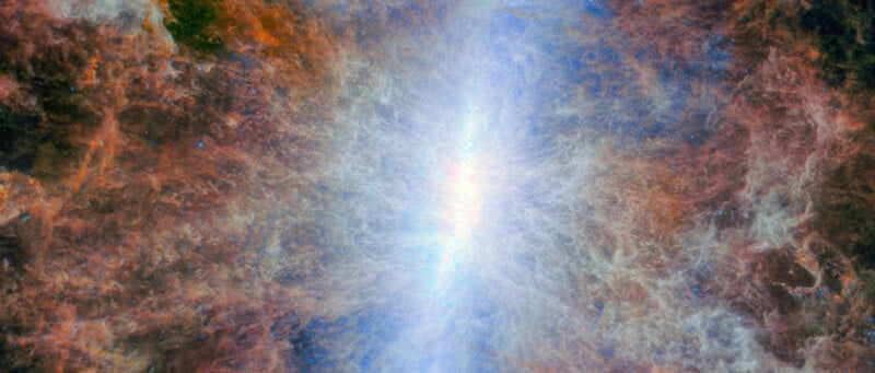 A bright, glowing central area with swirling clouds of blue, white, red, and orange, resembling an explosion or nebula in space with light radiating outward.
