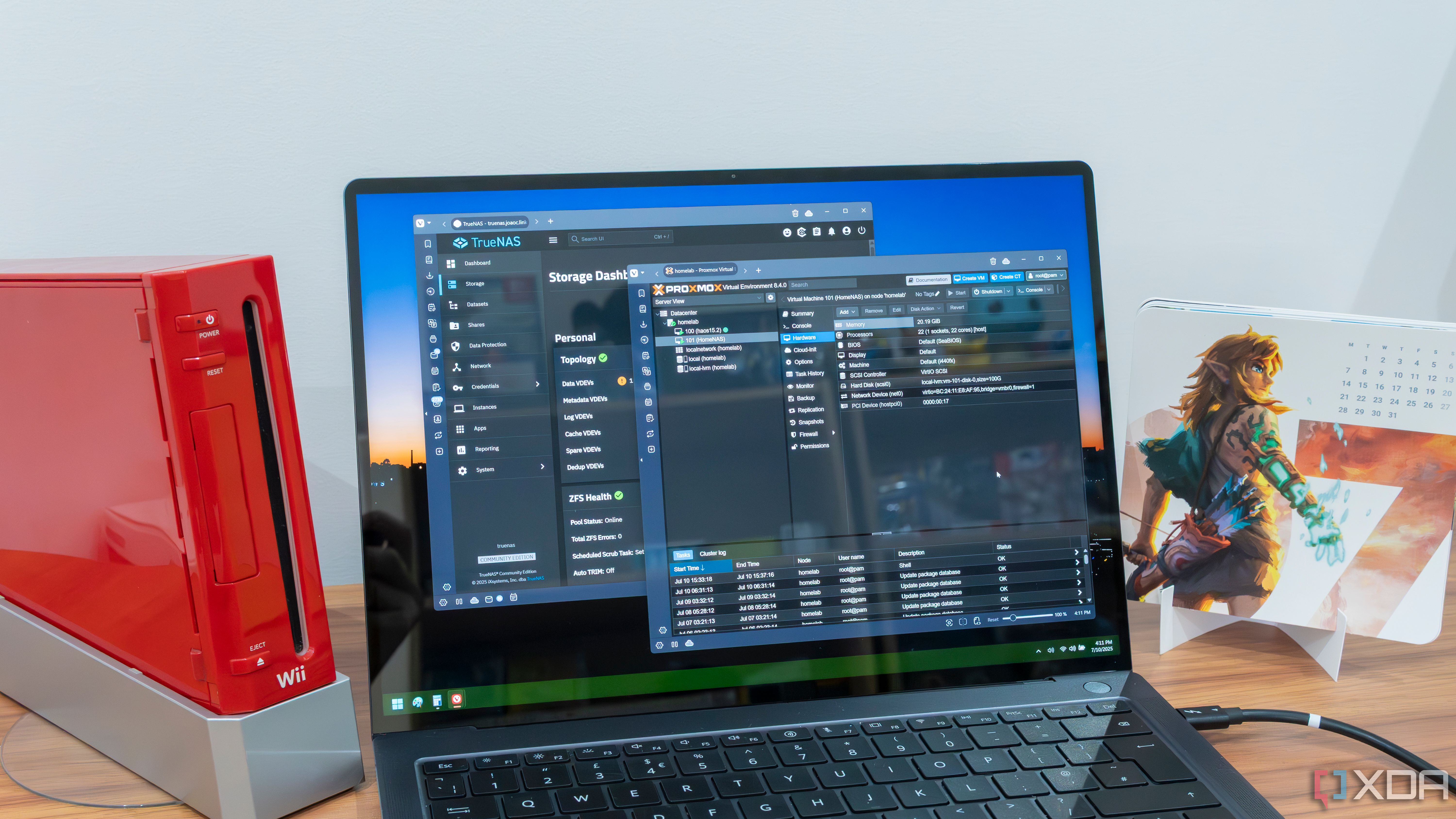 A Windows 11 laptop displaying the TrueNAS and Proxmox dashboards
