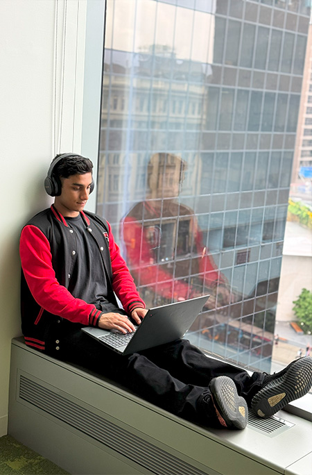 Rayyan working on window sill
