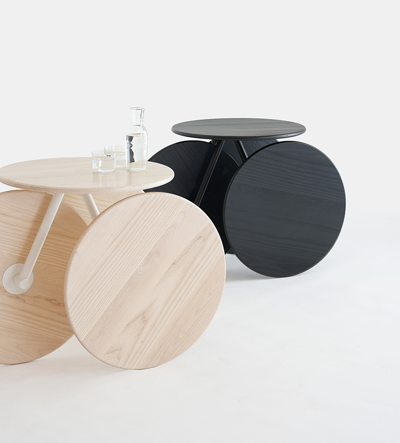 four identical wooden circles sculpt rolling table by mike & maaike