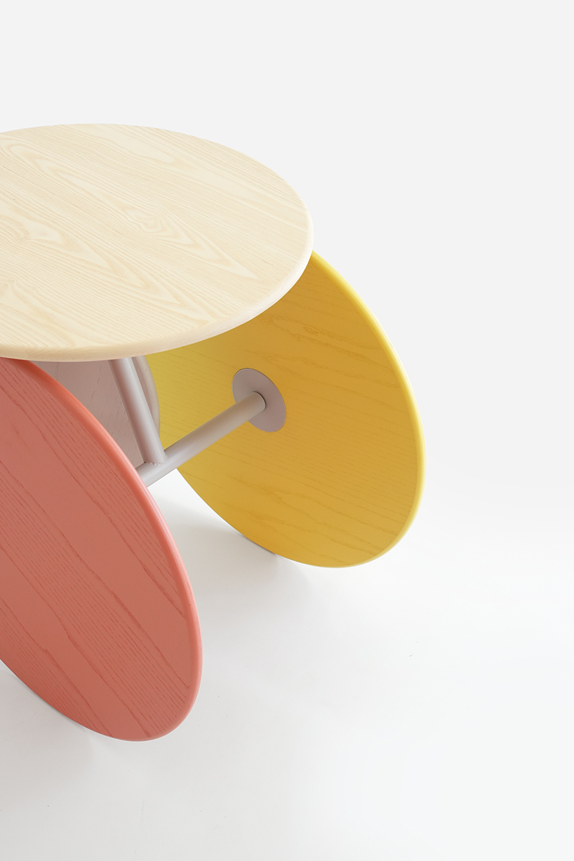 four identical wooden circles sculpt rolling table by mike & maaike