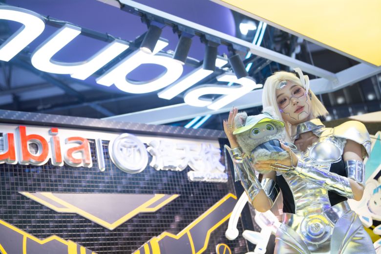A cosplayer presents the new AI doll Mochi at the Nubia booth at the Shanghai New Expo Center during the WAIC (World Artificial Intelligence Conference) 2025 in Shanghai, China, on July 28, 2025.
