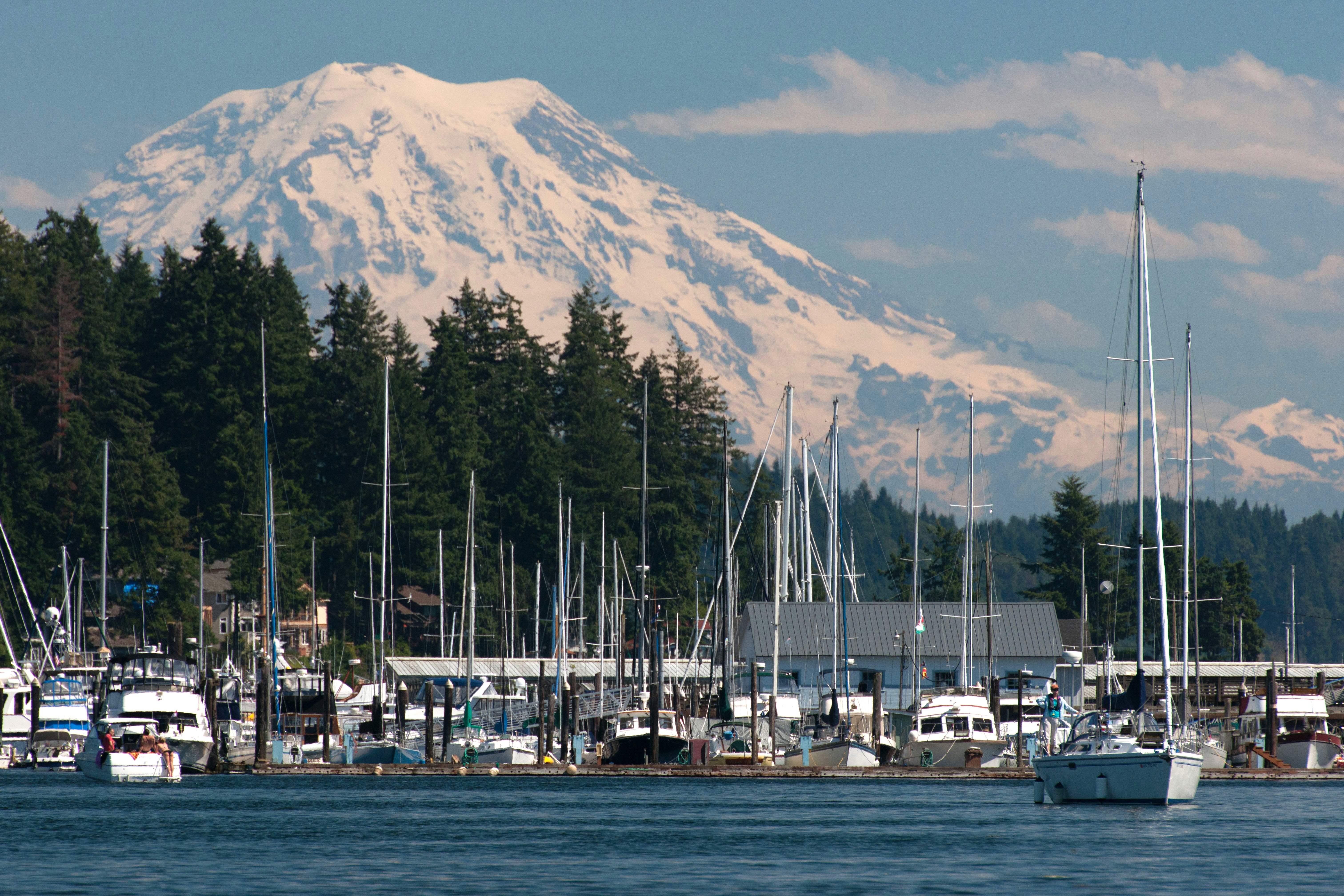 Boats and water at Gig Harbor with Mt Rainier and sky in the background