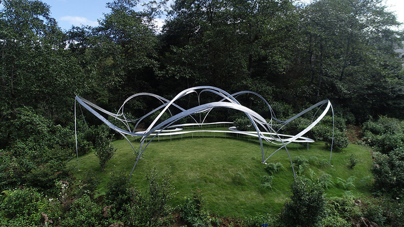 slender steel arcs blossom into kong xiangwei studio's camellia-like theater in china