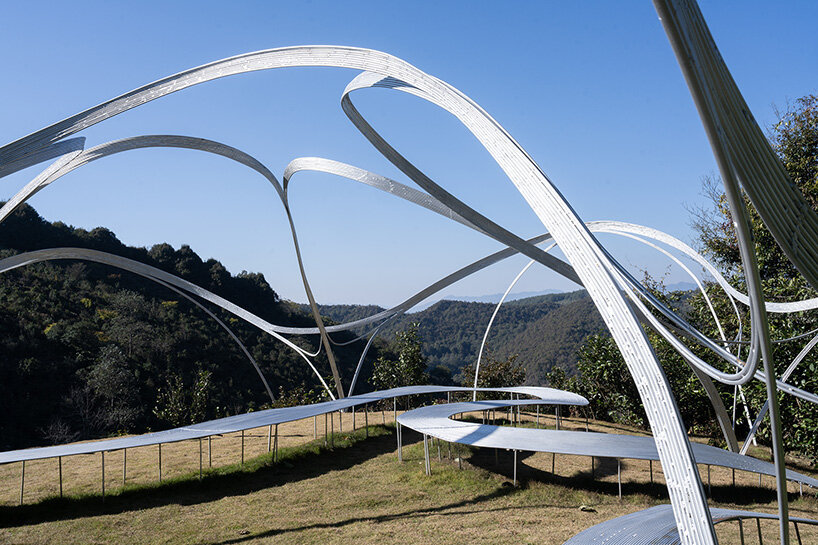 slender steel arcs blossom into kong xiangwei studio's camellia-like theater in china