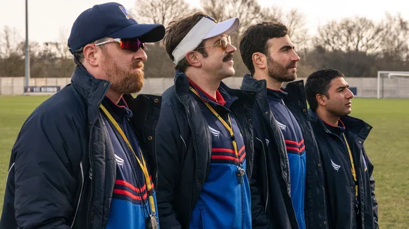 Ted Lasso Season 4: Meet the AFC Richmond Women’s Soccer Team 8 Jason Sudeikis, Brendan Hunt, Brett Goldstein and Nick Mohammad on the football ground in Ted Lasso.