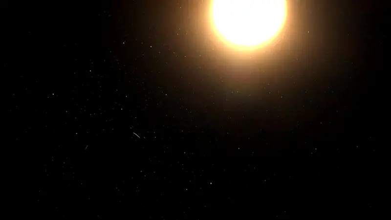 A glowing star being stretched into a swirling disk around a completely black object.