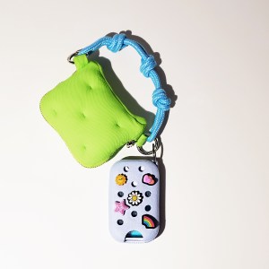 Crocs x Touchland Hand Mist Case in Cloudwave Blue attached to a mini bag.