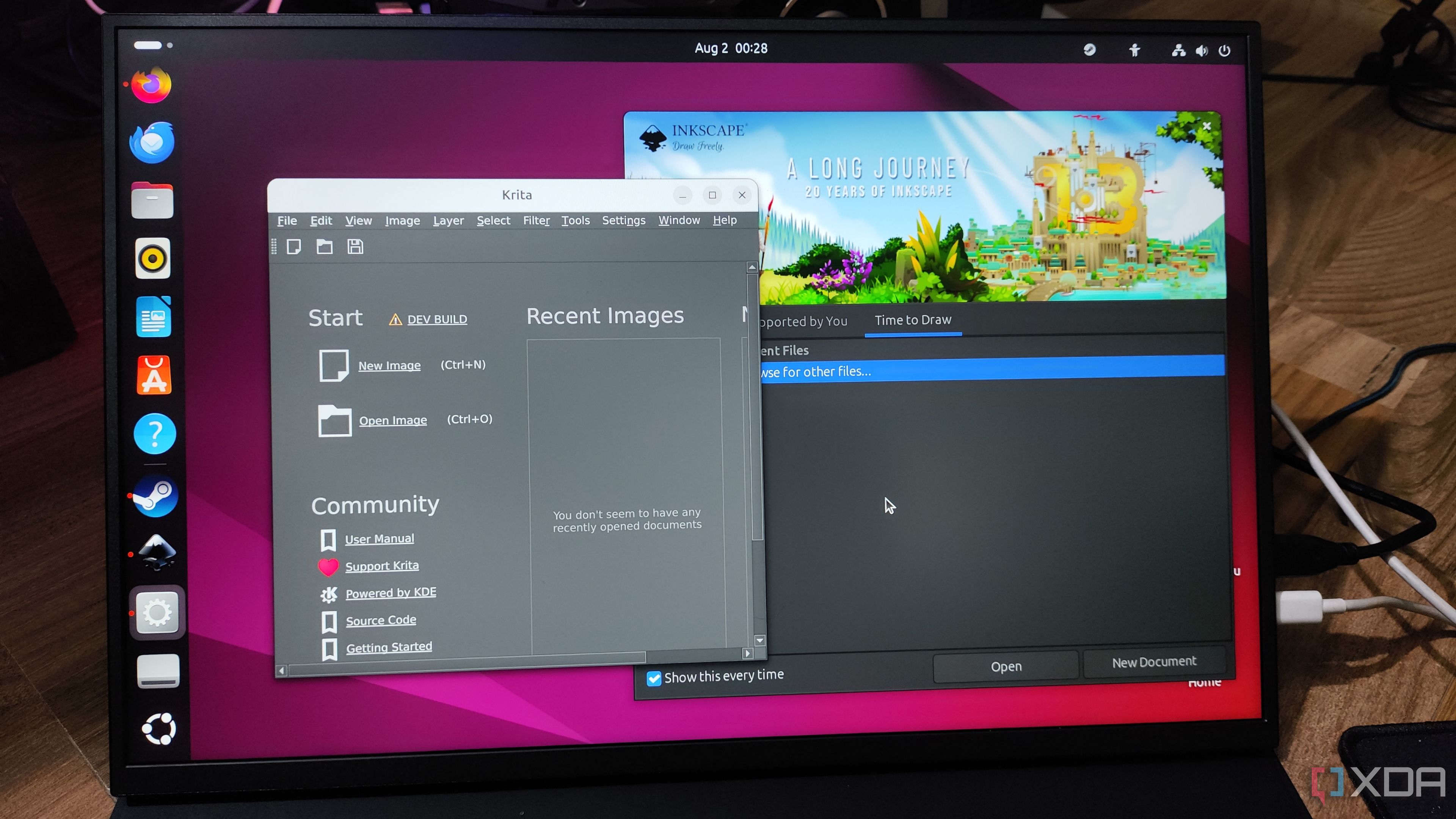 A Uperfect UGame K118 monitor displaying the Inkscape and Krita UI