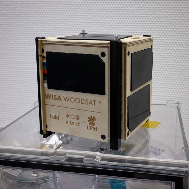 A cubic satellite on a clear tabletop