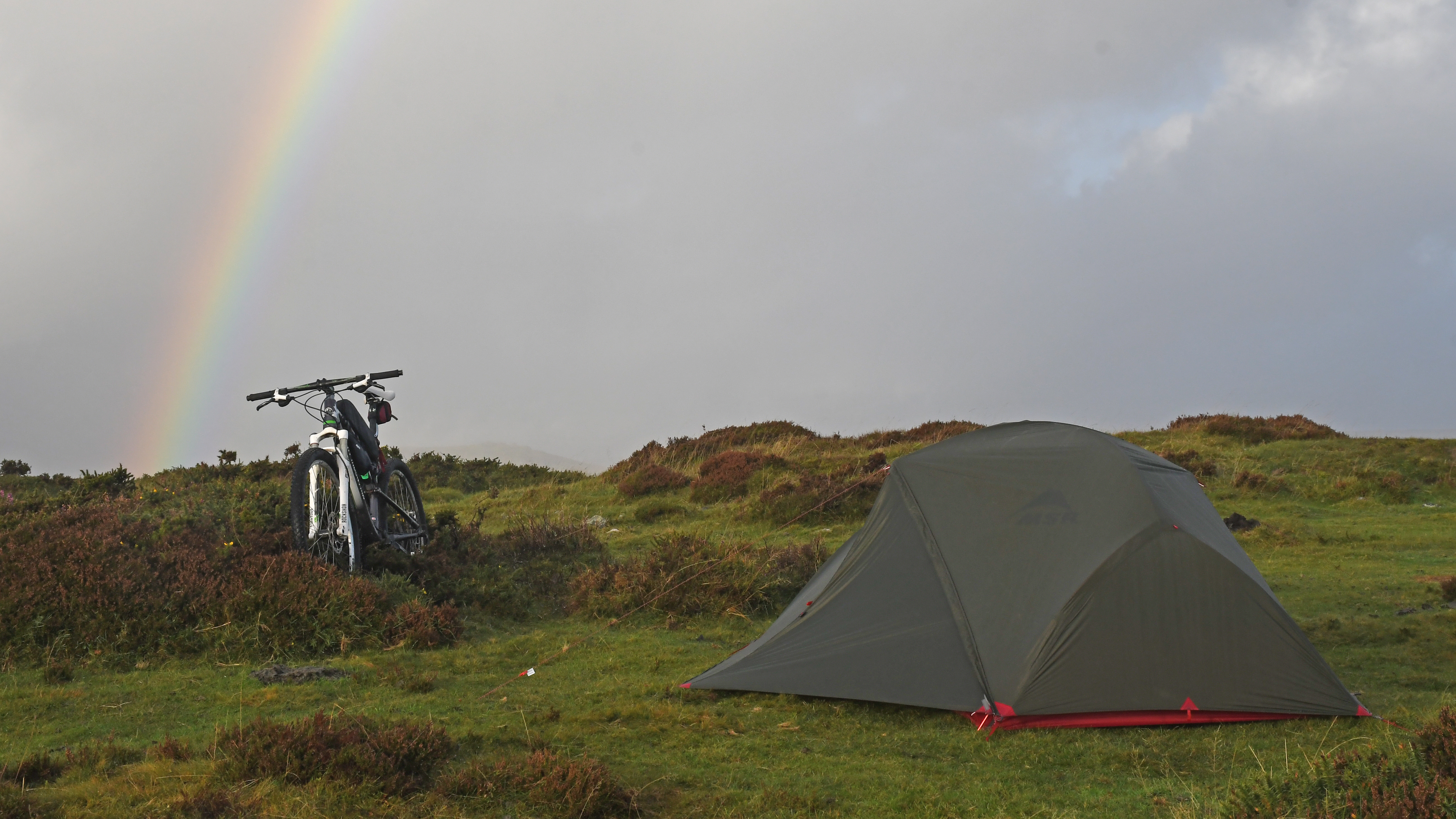 Showing the Hubba Hubba 1-P bike packing tent pitched next to a bike on Dartmoor
