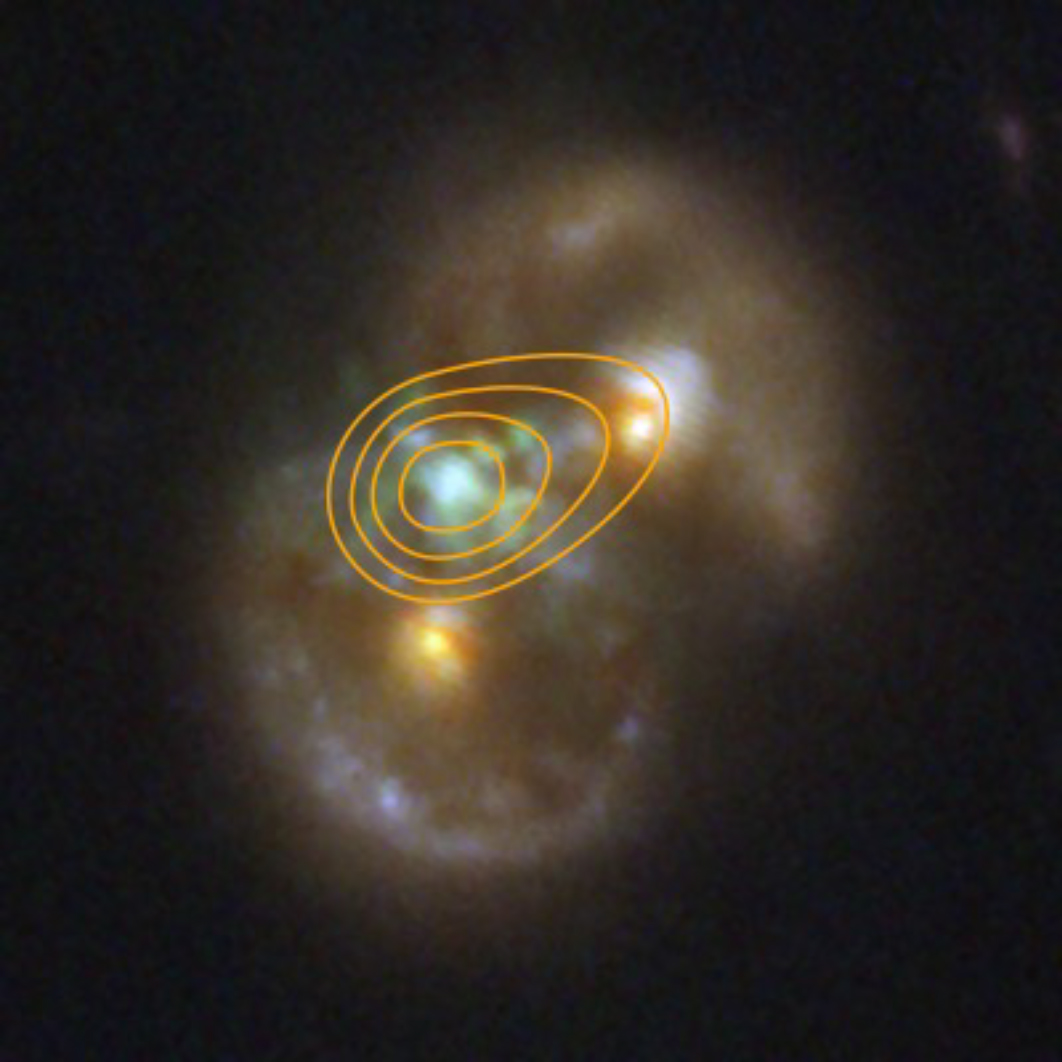 Two faint spherical clouds meet with a bright blue orb at the point of collision
