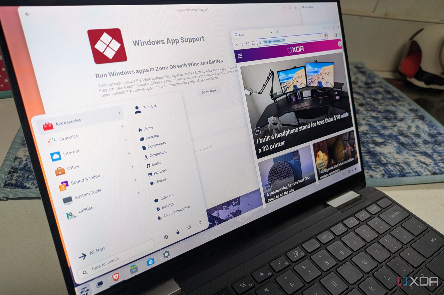 Shows ZorinOS running on laptop