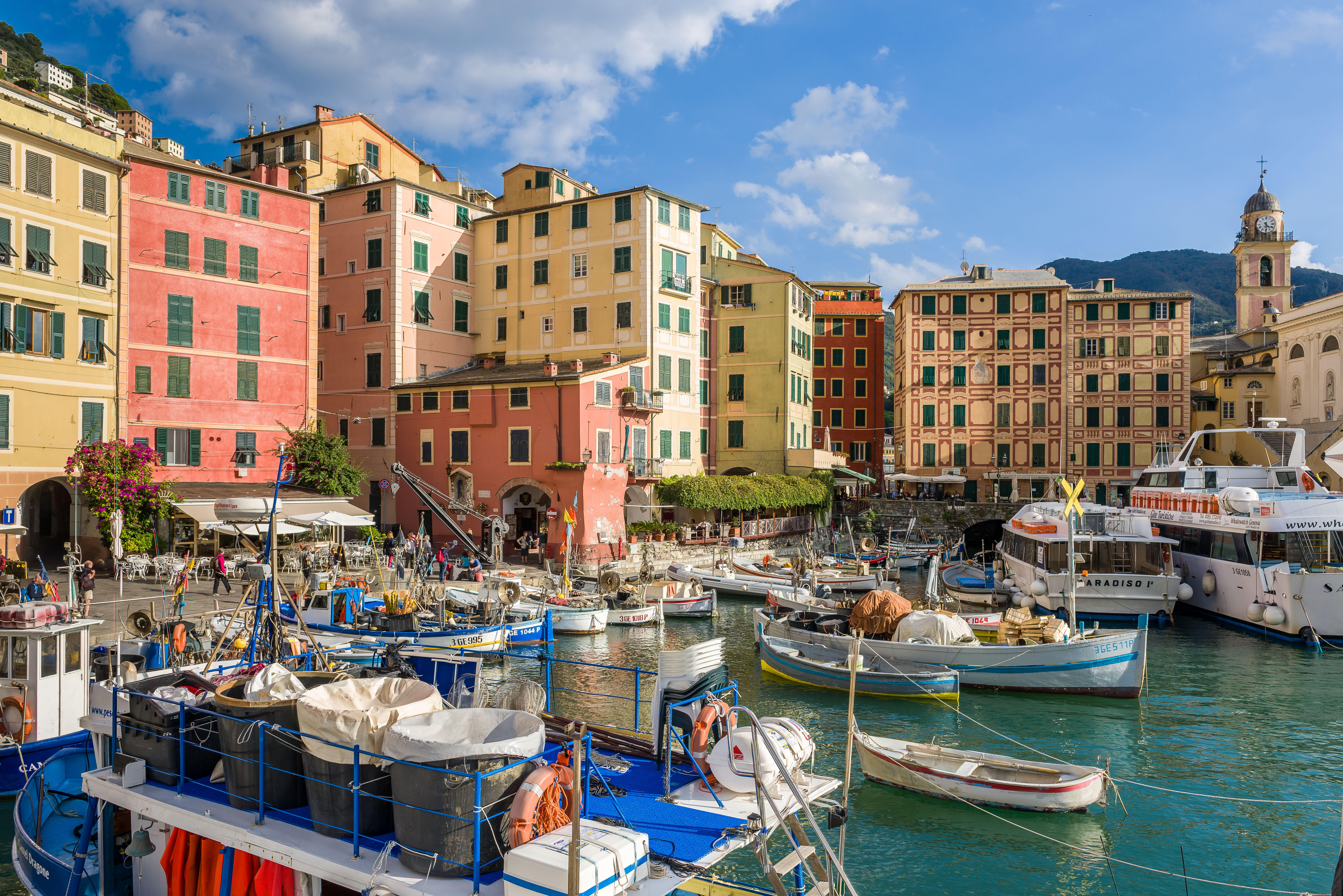Camogli harbor with colorful buildings and boats.
