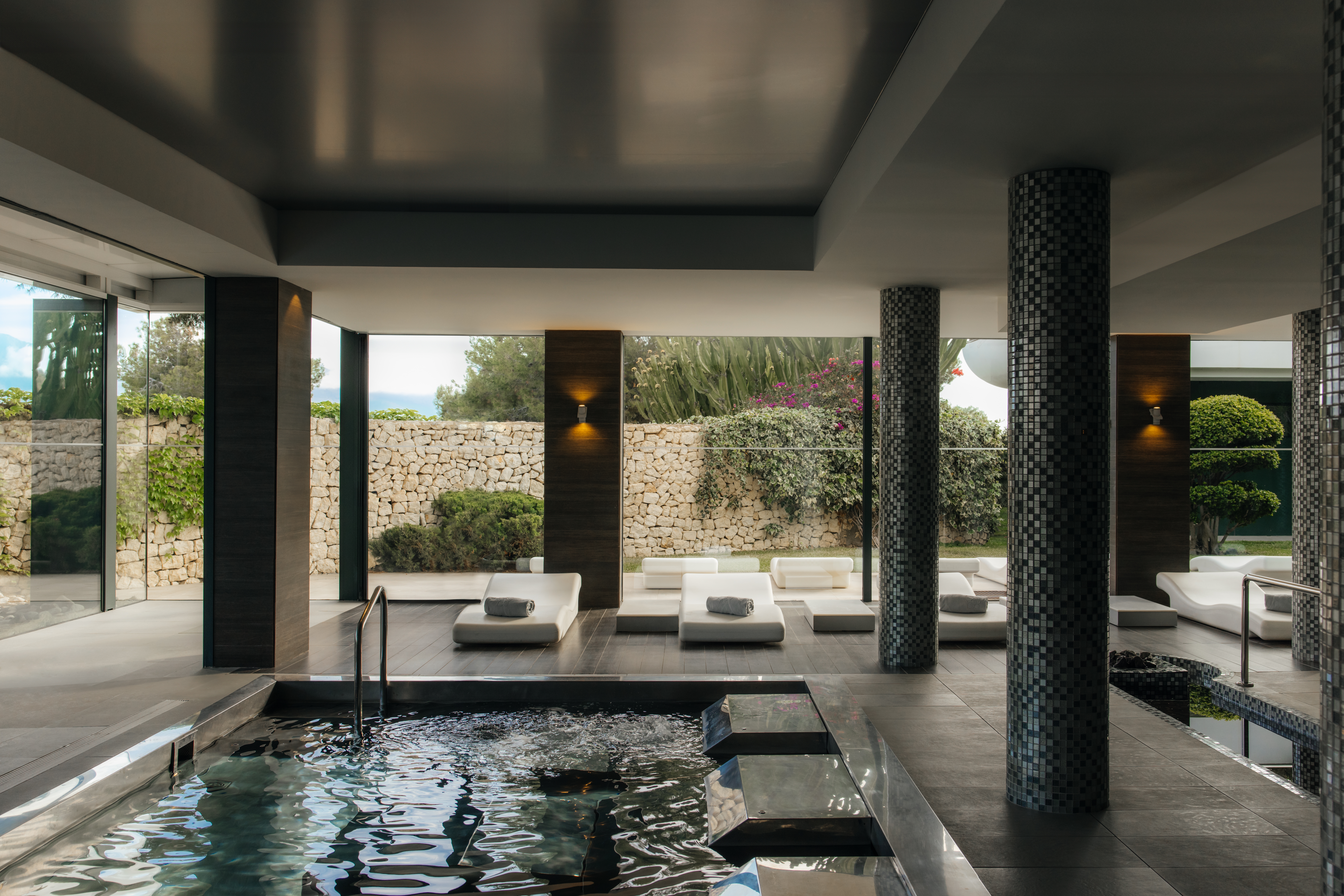 Indoor pool and lounge area at SHA Wellness Clinic in Alicante, Spain.