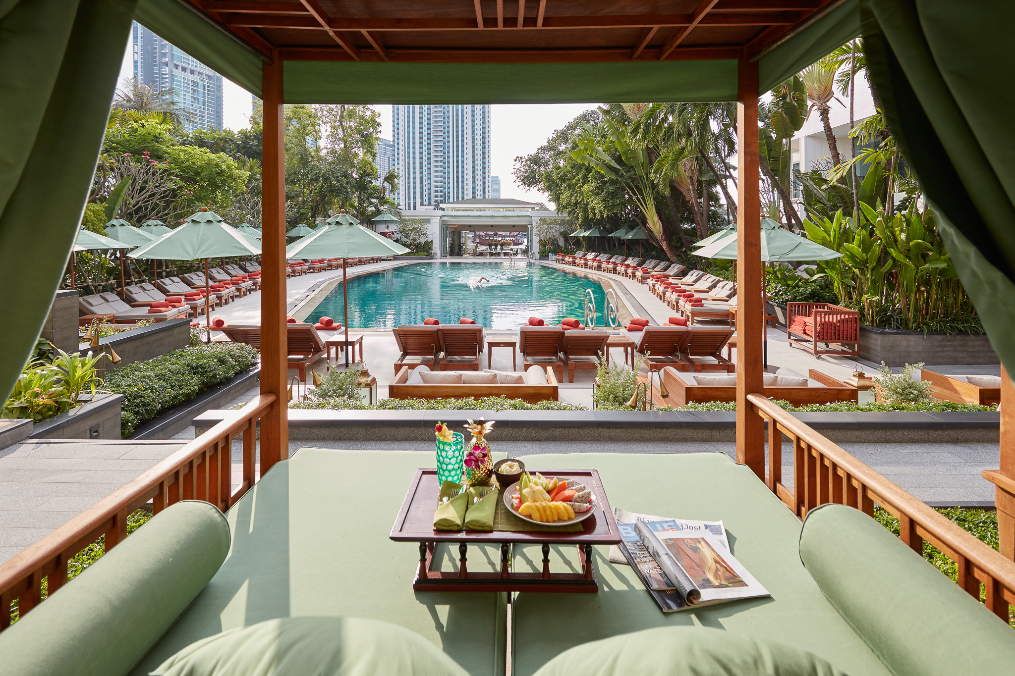 Poolside cabana with fruit and drinks.