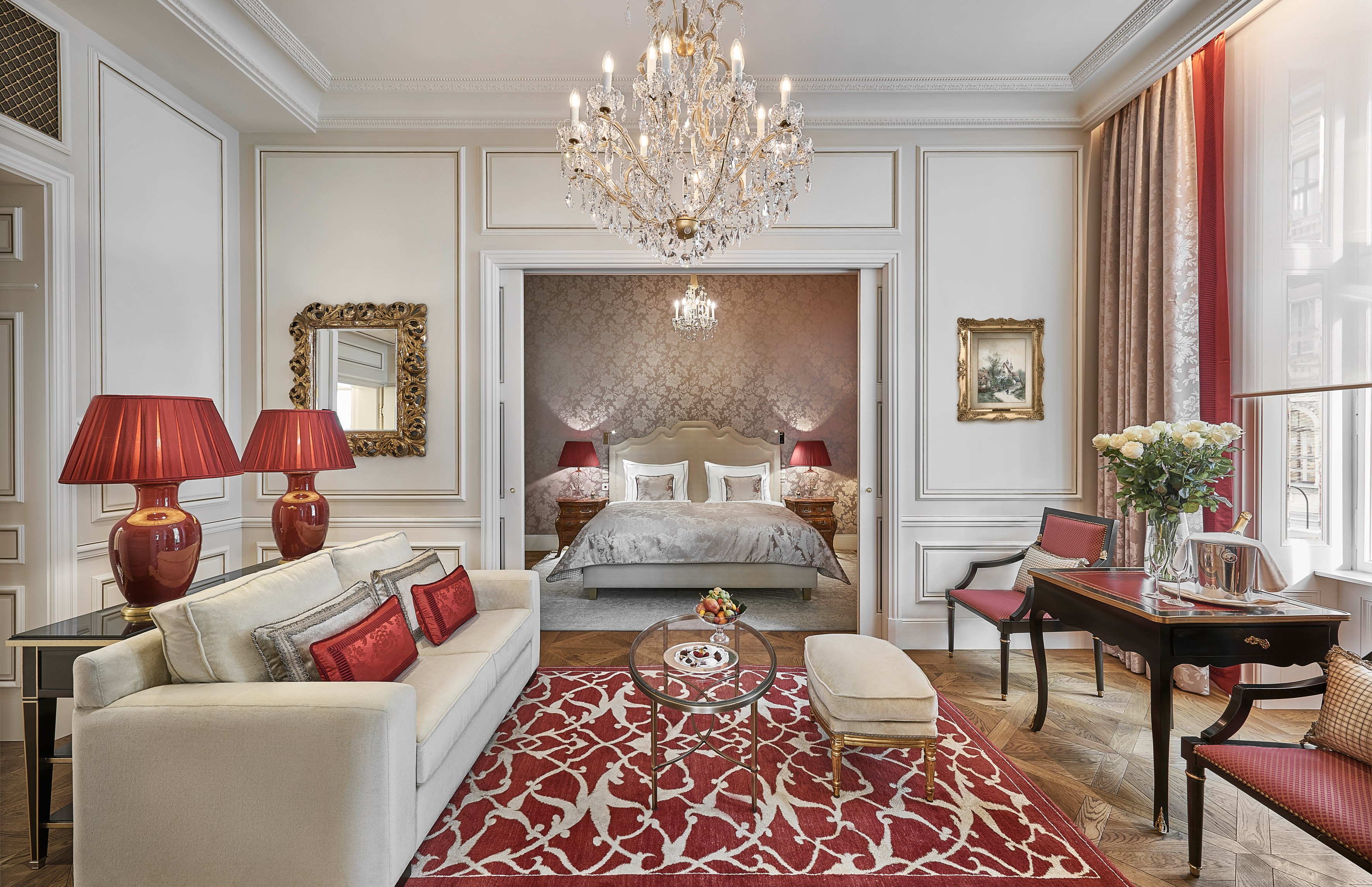 Hotel Sacher Vienna suite with sitting area and bedroom visible through an open doorway.