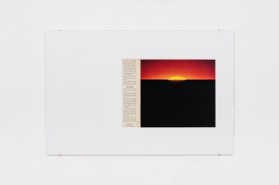 An image of a sunset from an LP sleeve in a minimalist glass frame.