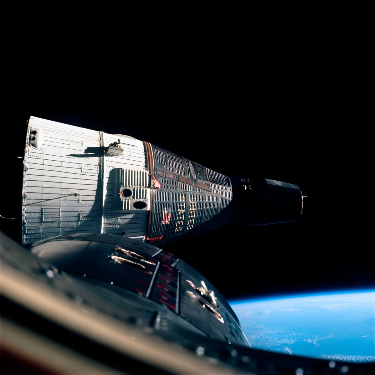 Gemini 7 is photographed at close quarters, from Gemini 6A, during the world's first space rendezvous (two vehicles meeting in space). Credit NASA / ASU / Andy Saunders
