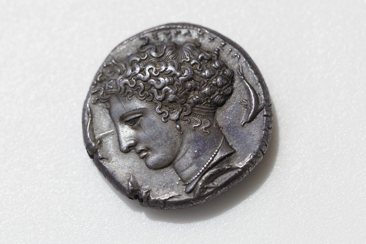 A close-up of an ancient Greek coin. 
