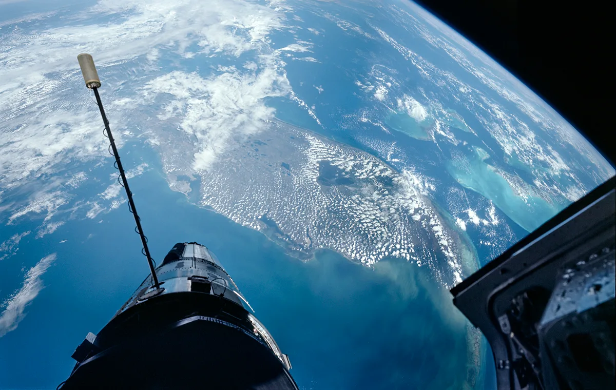 Three separate remastered photographs, stitched together, showing Florida, an uncrewed Agena target vehicle, and the open Gemini hatch (right), during Buzz Aldrin's spacewalk on Gemini 12, 12th November, 1966. Credit NASA / ASU / Andy Saunders