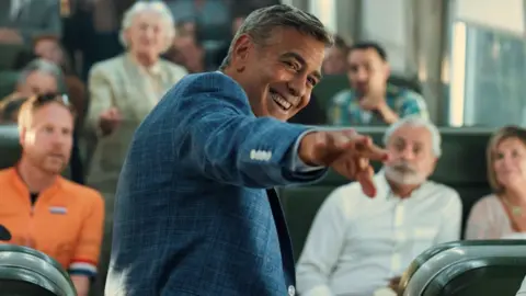 Netflix Lars Eidinger as German Cyclist, Ferdi Stofmeel as Dutch Cyclist and George Clooney as Jay Kelly in Jay Kelly