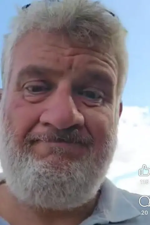 Cameron Farquharson A selfie of Mr Farquharson, who has short grey hair and a grey beard. It is a screenshot of his social media video.