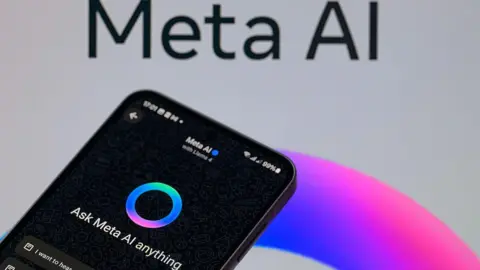 Getty Images A black smartphone displaying Meta AI is shown next to a background of a post for Meta AI
