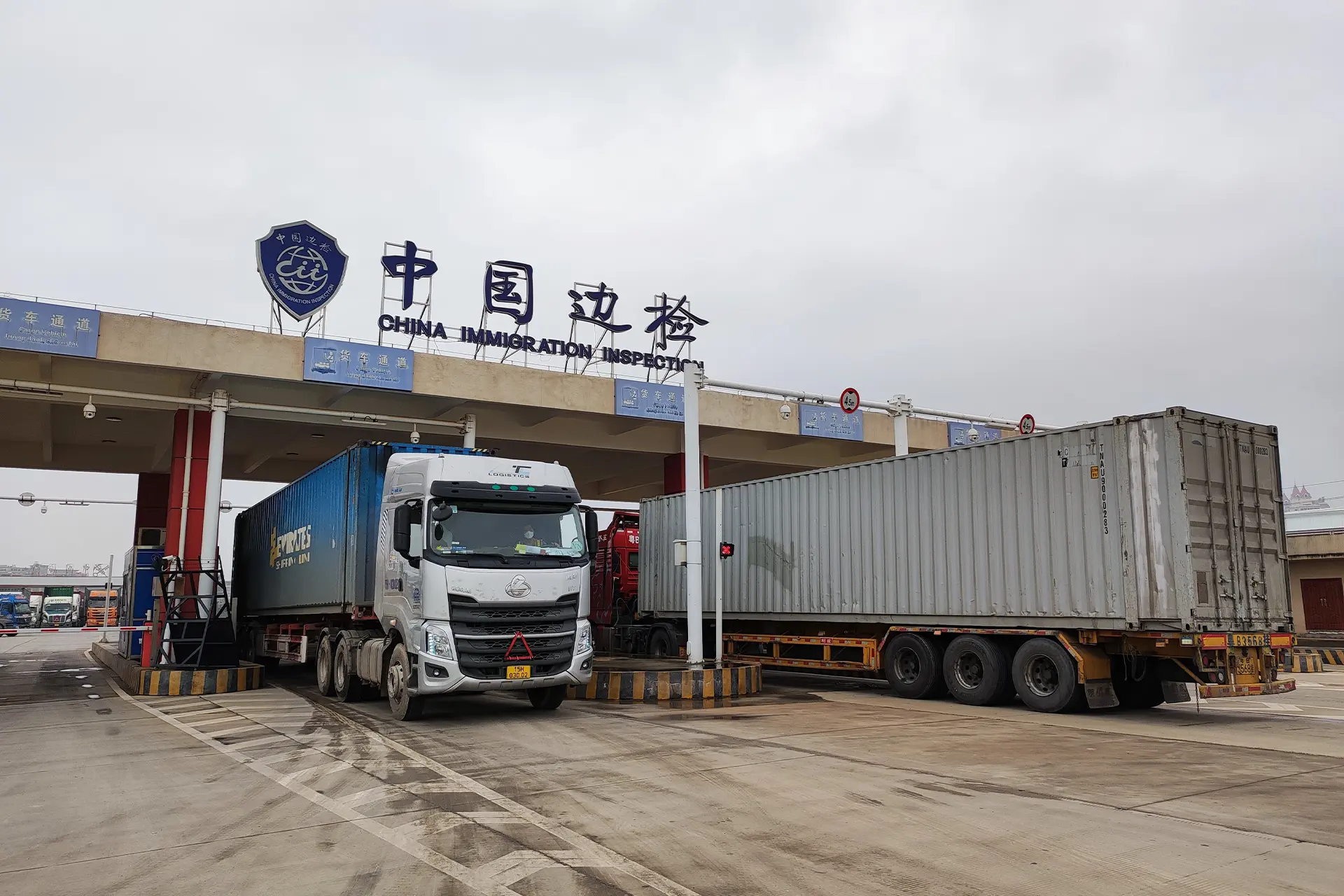 Trucks coming and going from an immigration checkpoint on the Chinese border