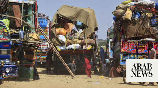 A roadside bomb targeting police vehicle in northwest Pakistan kills 2 officers and wounds 14