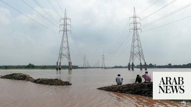 Two Pakistan towns face flood risk if river barrage crumbles, officials say
