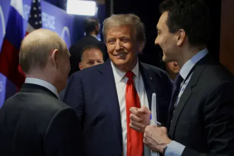Reuters Putin and Trump share a joke. The atmosphere between the two appeared convivial throughout. 