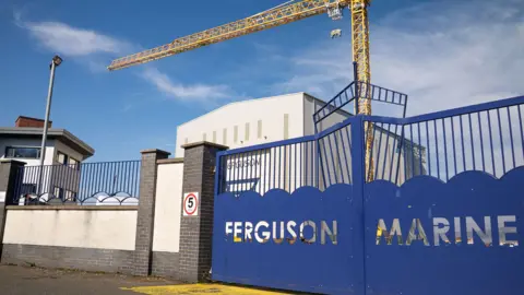 BBC A blue gate at Ferguson shipyard with the words Ferguson Marine cut out