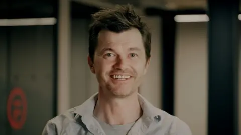 Flawless Scott Mann, the founder of Flawless, smiling and dressed casually.