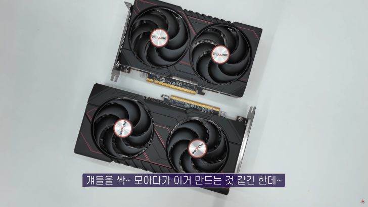 Two graphics cards with cooling fans on a white background.