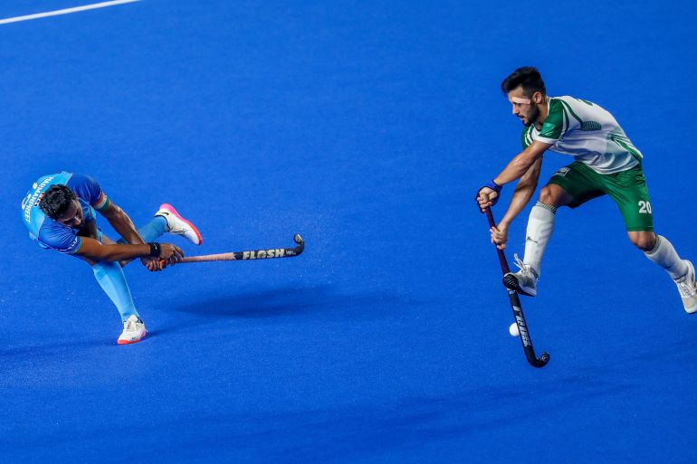 India's captain Harmanpreet Singh, left, is challenged by Pakistan's Afraz during the men's Asian Champions Trophy hockey match between India and Pakistan in Chennai, India, Wednesday, Aug. 9, 2023. (AP Photo/R. Parthibhan)