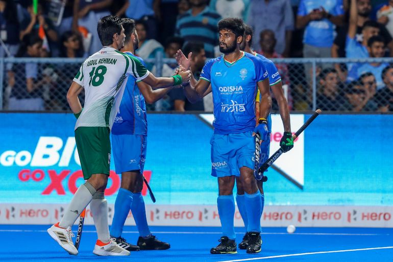 Pakistan's Abdul Rehman, left, greets Indian players after India won the men's Asian Champions Trophy hockey match against Pakistan in Chennai, India, Wednesday, Aug. 9, 2023. (AP Photo/R. Parthibhan)