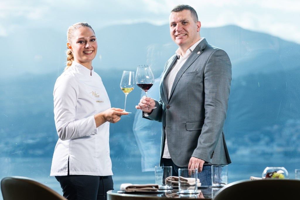 Chef Gabriela Filca and Sommelier Tomislav Mikinac at Nebo Restaurant & Lounge toasting with wine in hand