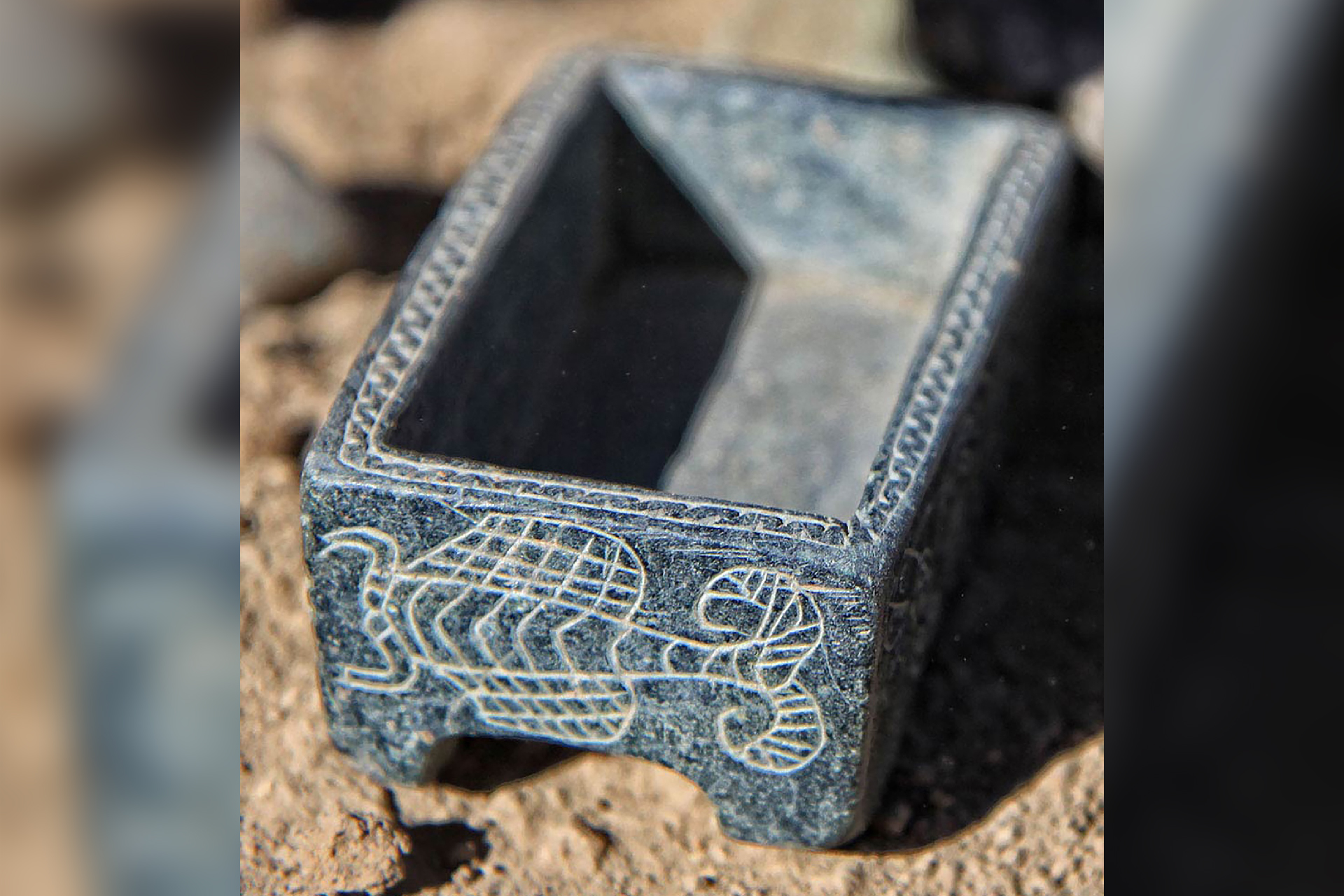 a close-up of an engraved blue box