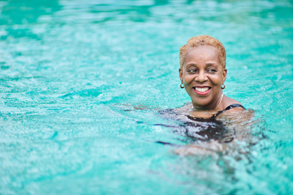 Close-up portrait of a mature woman swimming