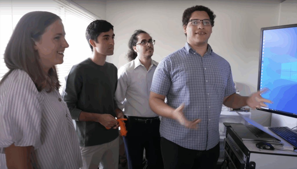 UC Berkeley Ph.D. student Kaylo Littlejohn stands with other researchers during a clinical trial in 2023