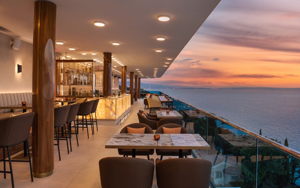 Nebo Restaurant & Lounge at Hilton Rijeka Costabella Beach Resort & Spa outdoor dining seating area overlooking water