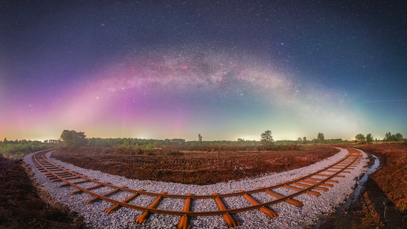 Winning image in the Public Vote category: Symmetry, by Anthony Lynch, Dublin. 'The train tracks are a new feature in this sculpture park in Boora,' says Anthony. 'I used an astro modified Canon 6D with a 20mm lens at f/2 and ISO 800 to capture this sweeping panorama of the milky way across the top with the tracks. It's about a 20-shot pano with each shot being 15 seconds exposure'
