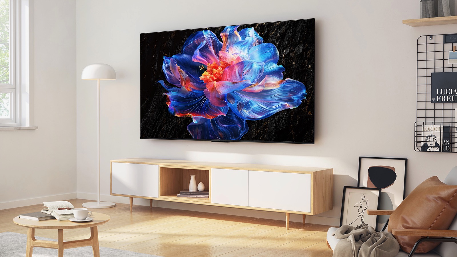 A TCL V6C TV wall-mounted above a side unit in a light, airy lounge.